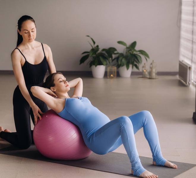 pregnant woman with physical therapist