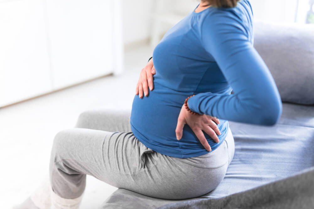 is lower back pain normal in the early stages of pregnancy?