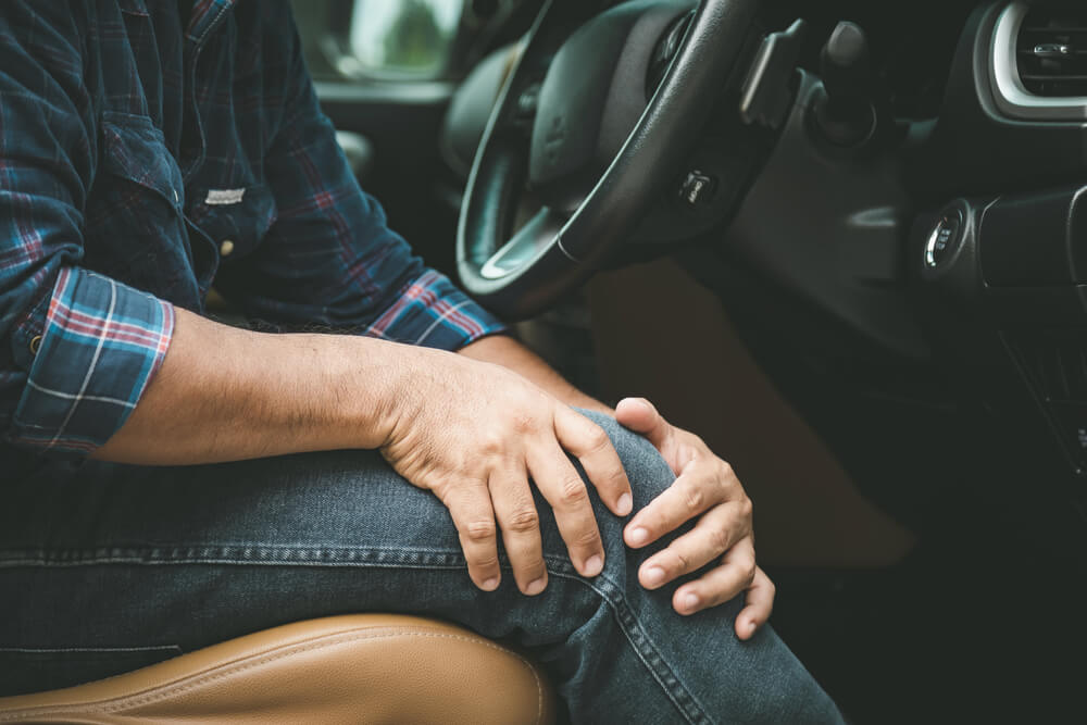 What could be behind your knee pain from driving? shutterstock 1819296842 knee pain from driving